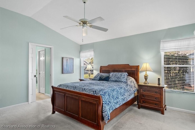 carpeted bedroom with ceiling fan and lofted ceiling