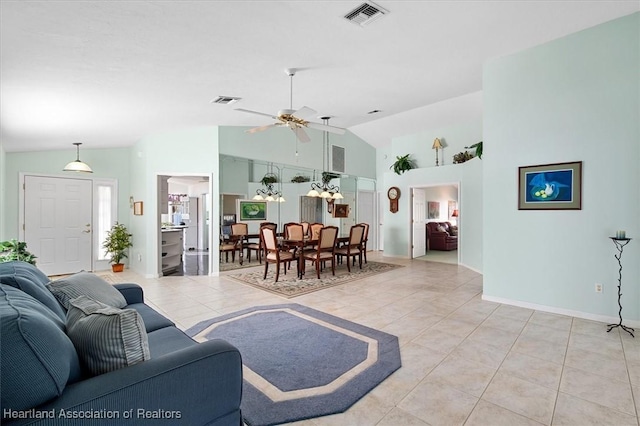 living room featuring ceiling fan, light tile patterned flooring, and lofted ceiling