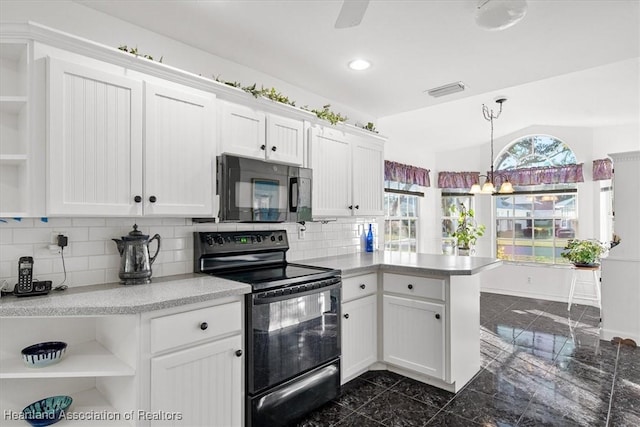 kitchen featuring backsplash, white cabinetry, black appliances, and kitchen peninsula