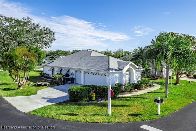 ranch-style home with a garage and a front yard