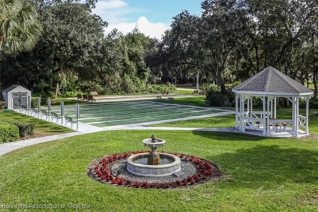 surrounding community featuring a gazebo and a lawn