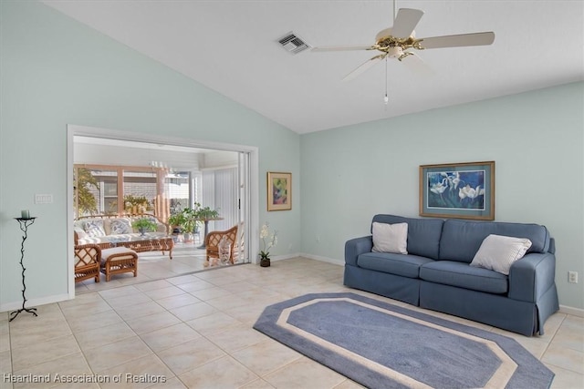 tiled living room featuring ceiling fan and lofted ceiling