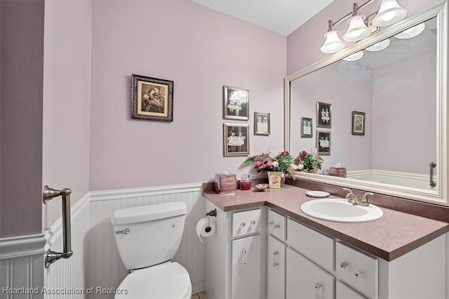 bathroom with toilet and vanity