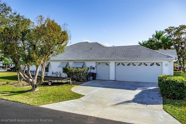 ranch-style home with a garage and a front yard