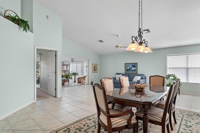 dining room with ceiling fan, light tile patterned floors, and high vaulted ceiling