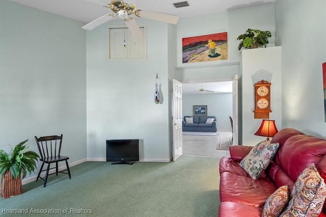 living room with ceiling fan and light colored carpet