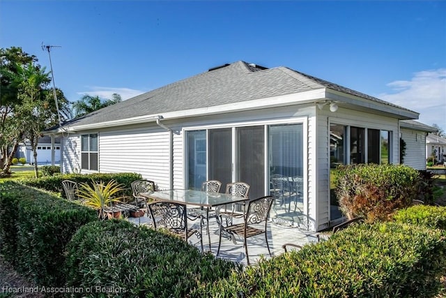 rear view of house featuring a patio