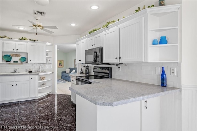 kitchen featuring white cabinets, black appliances, sink, kitchen peninsula, and ceiling fan