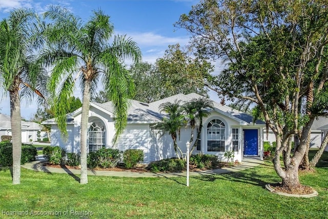 ranch-style house with a front yard