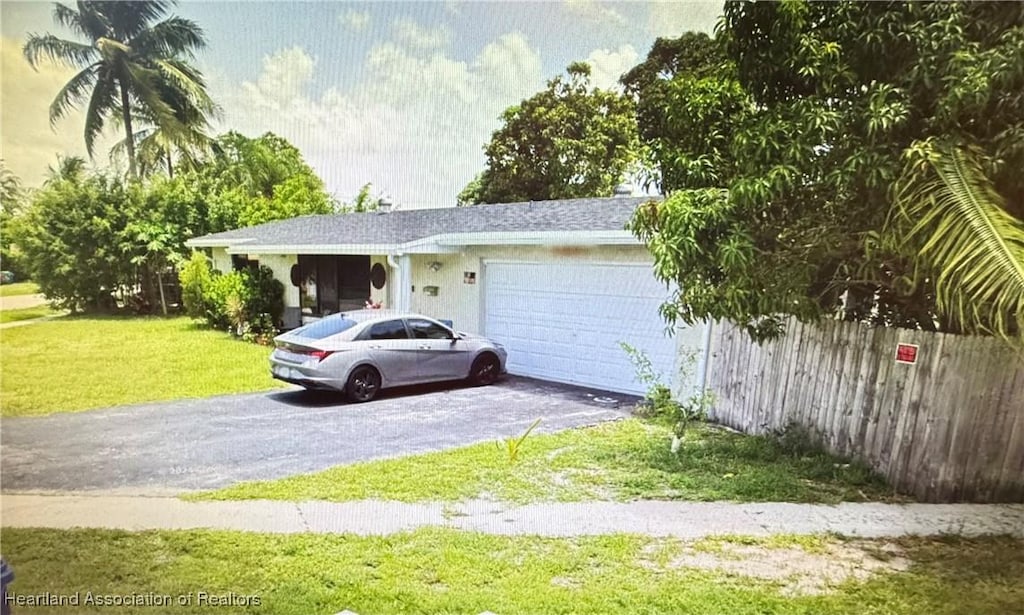 garage featuring a yard