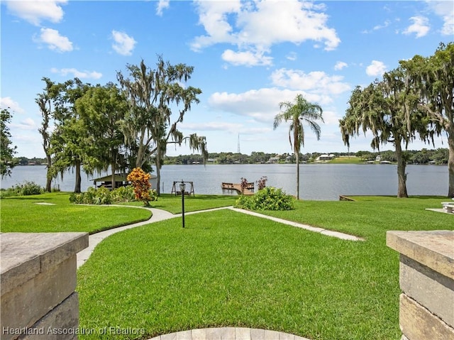 exterior space with a yard and a water view
