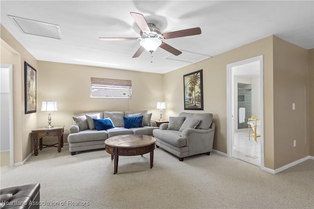 living area featuring a ceiling fan, baseboards, carpet, and visible vents