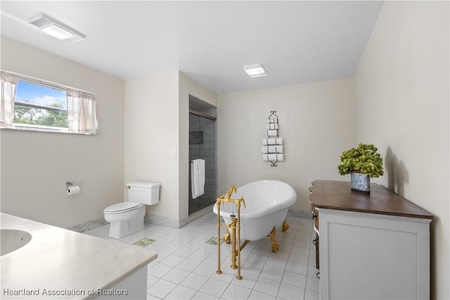 bathroom with a freestanding tub, vanity, tile patterned flooring, visible vents, and a stall shower