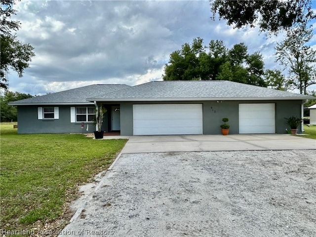 ranch-style house with a front lawn and a garage