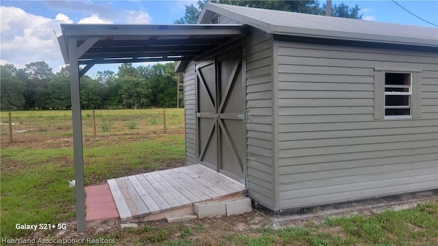 view of outdoor structure featuring a yard