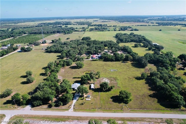 birds eye view of property with a rural view