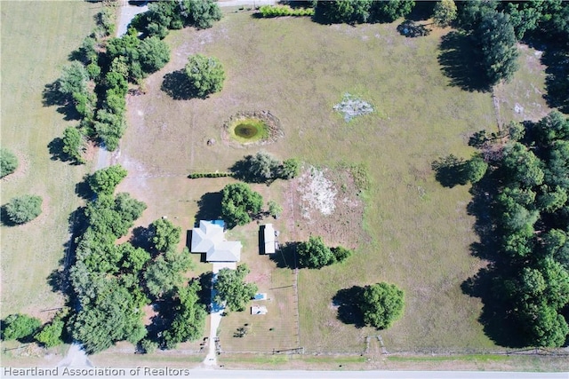 birds eye view of property featuring a rural view