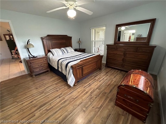 bedroom featuring ceiling fan and hardwood / wood-style flooring