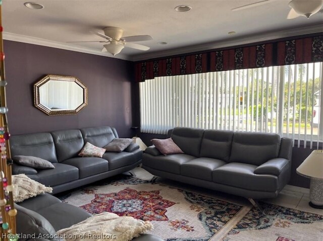 tiled living room featuring ceiling fan and crown molding