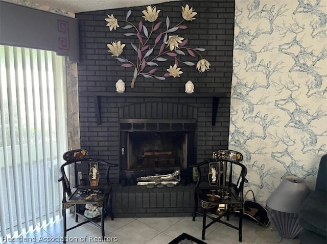 interior details with a textured ceiling and a brick fireplace