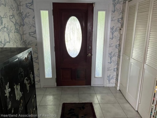 entrance foyer with light tile patterned floors