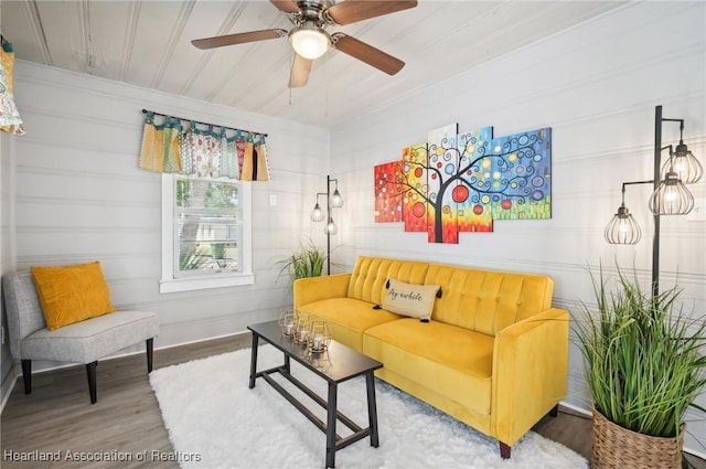 living room with hardwood / wood-style flooring and ceiling fan