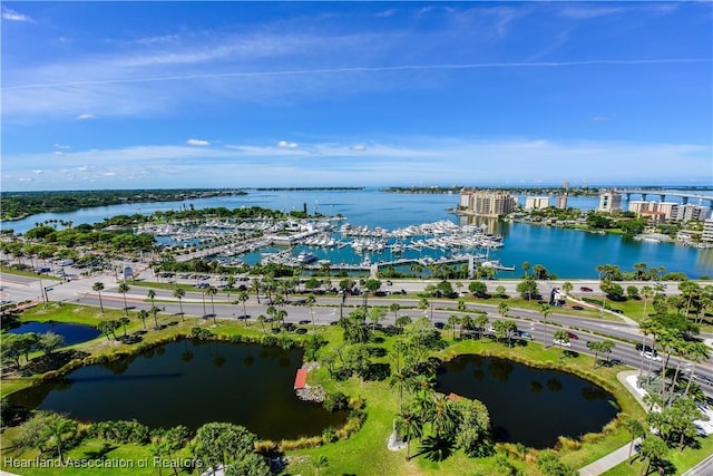 birds eye view of property featuring a water view