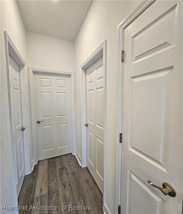 3040 W Joliet Rd, Avon Park, FL 33825 - hall with dark wood-style flooring