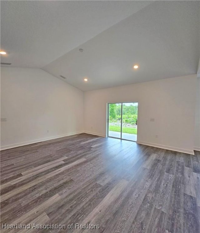 3040 W Joliet Rd, Avon Park, FL 33825 - spare room featuring dark wood-style floors, vaulted ceiling, and recessed lighting