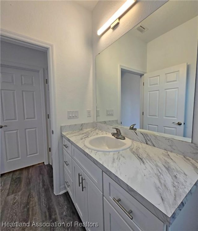 3040 W Joliet Rd, Avon Park, FL 33825 - bathroom featuring vanity and wood finished floors