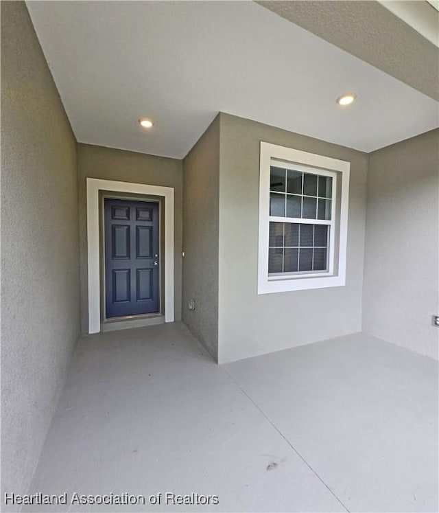 3040 W Joliet Rd, Avon Park, FL 33825 - entrance to property featuring stucco siding and a patio area