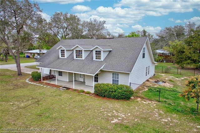 view of front facade with a patio and a front yard