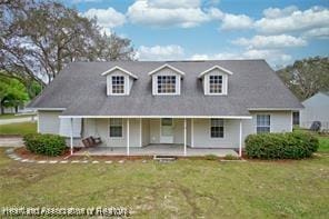 rear view of house with a yard