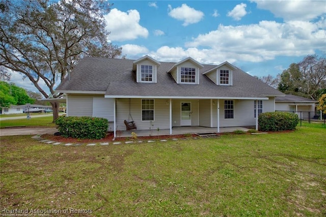 view of front of home featuring covered porch and a front yard