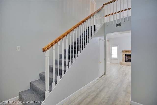 staircase with wood-type flooring