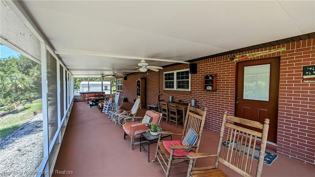 sunroom / solarium with ceiling fan