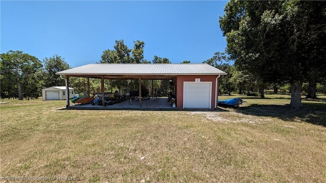 exterior space featuring a carport and a yard