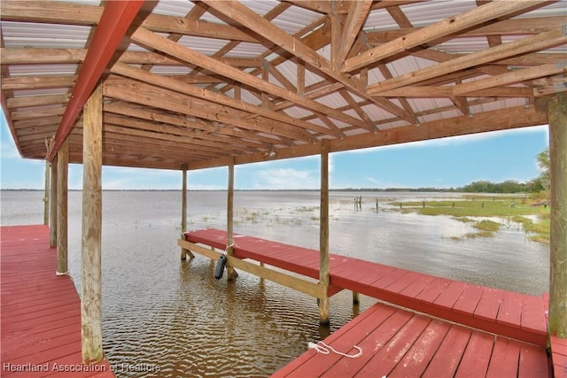 dock area with a water view