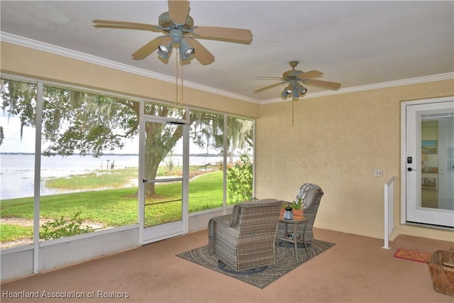 sunroom featuring ceiling fan