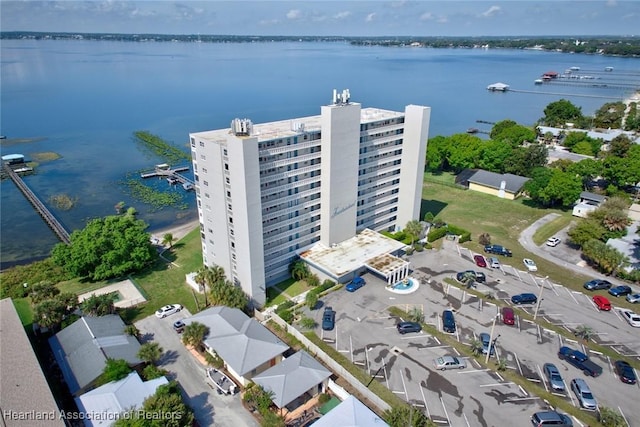 birds eye view of property with a water view