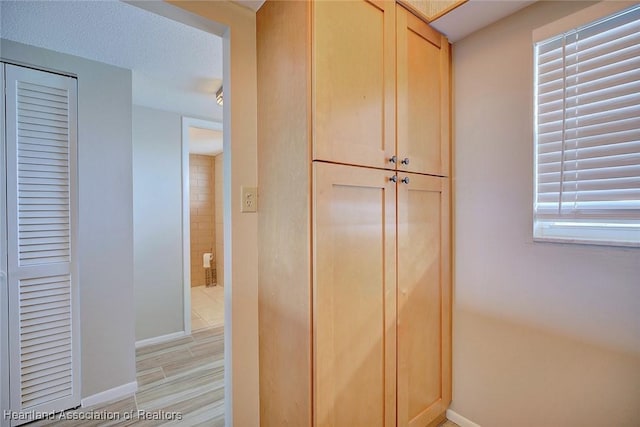 room details featuring baseboards and wood finished floors