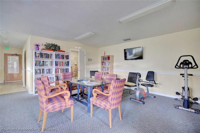 dining space featuring carpet floors, visible vents, and baseboards