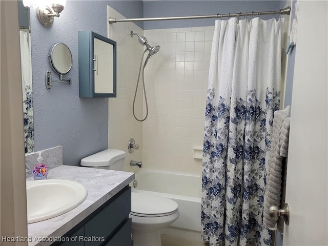 full bathroom with vanity, toilet, and shower / bath combo with shower curtain