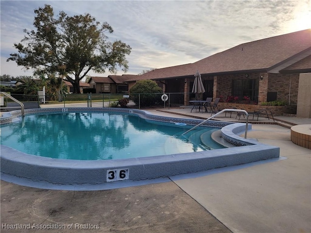 view of swimming pool featuring a patio