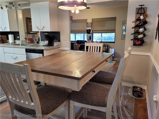 dining room featuring sink and light hardwood / wood-style floors