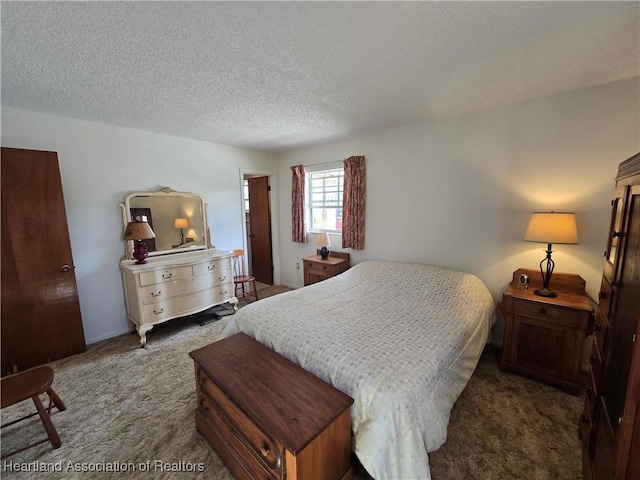 carpeted bedroom with a textured ceiling