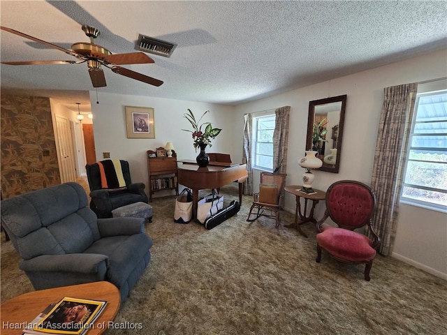 living room featuring carpet flooring and a textured ceiling