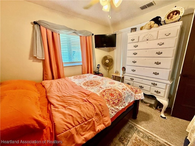 bedroom featuring ceiling fan and visible vents