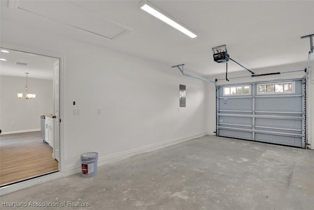 garage with electric panel and a garage door opener