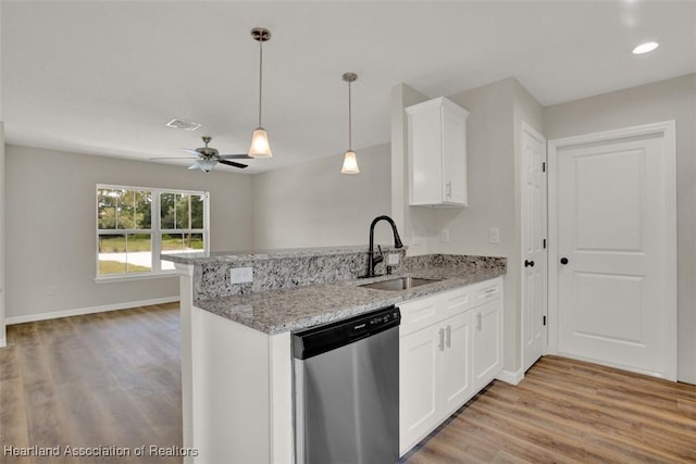 kitchen with light stone countertops, stainless steel dishwasher, ceiling fan, sink, and white cabinetry